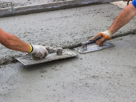 Leveling concrete with trowels